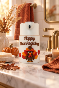 Happy Thanksgiving soap dispenser cover with a pilgrim turkey on a touch-free automatic dispenser in a cozy fall bathroom